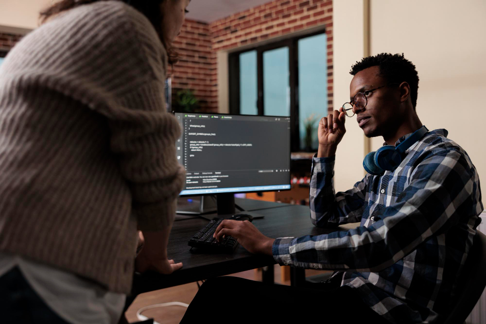 software-developers-sitting-desk-developing-functional-data-encryption-system-multiethnic-cyber-security-team-members-agency-office-writing-cloud-database-processing-algorithm (1)